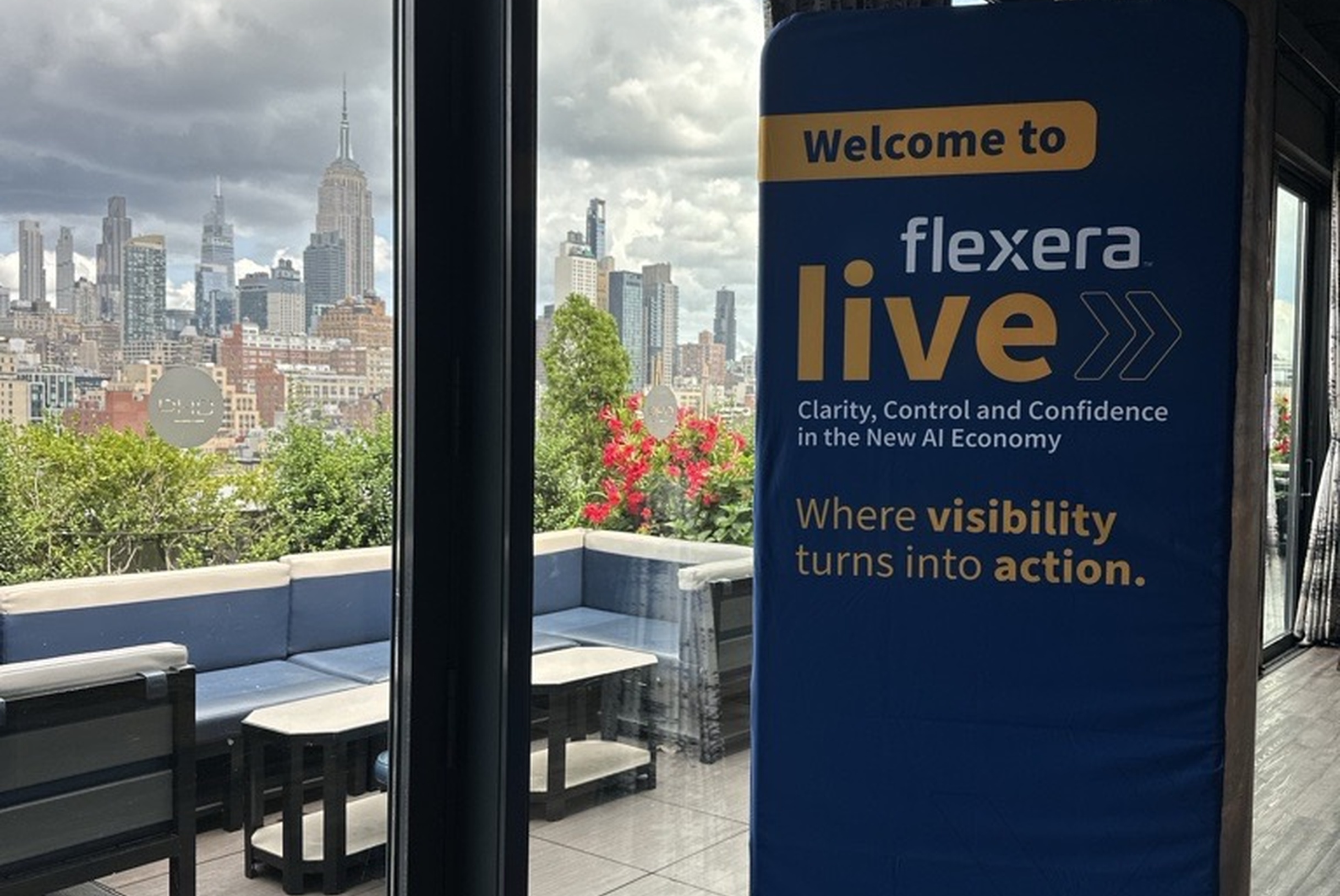 Flexera Live sign with the skyline view from Dream Downtown by Hyatt